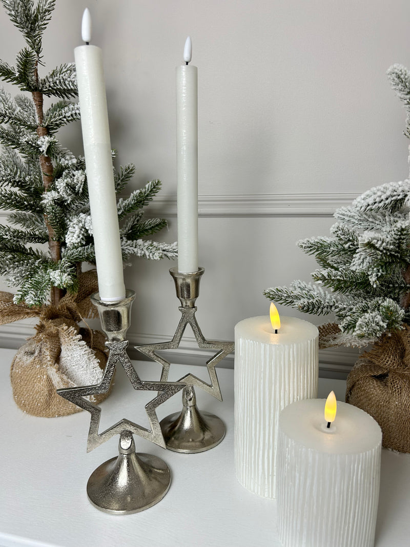 Pair of star silver candle sticks