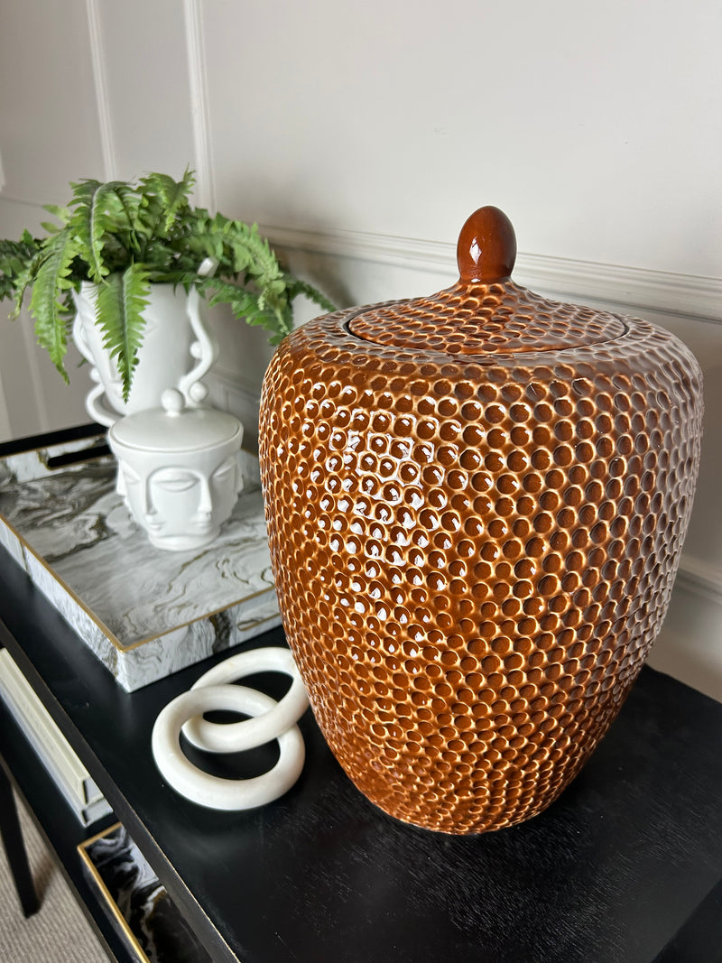 Burnt orange bobble pitted hammered ceramic lidded vase jar