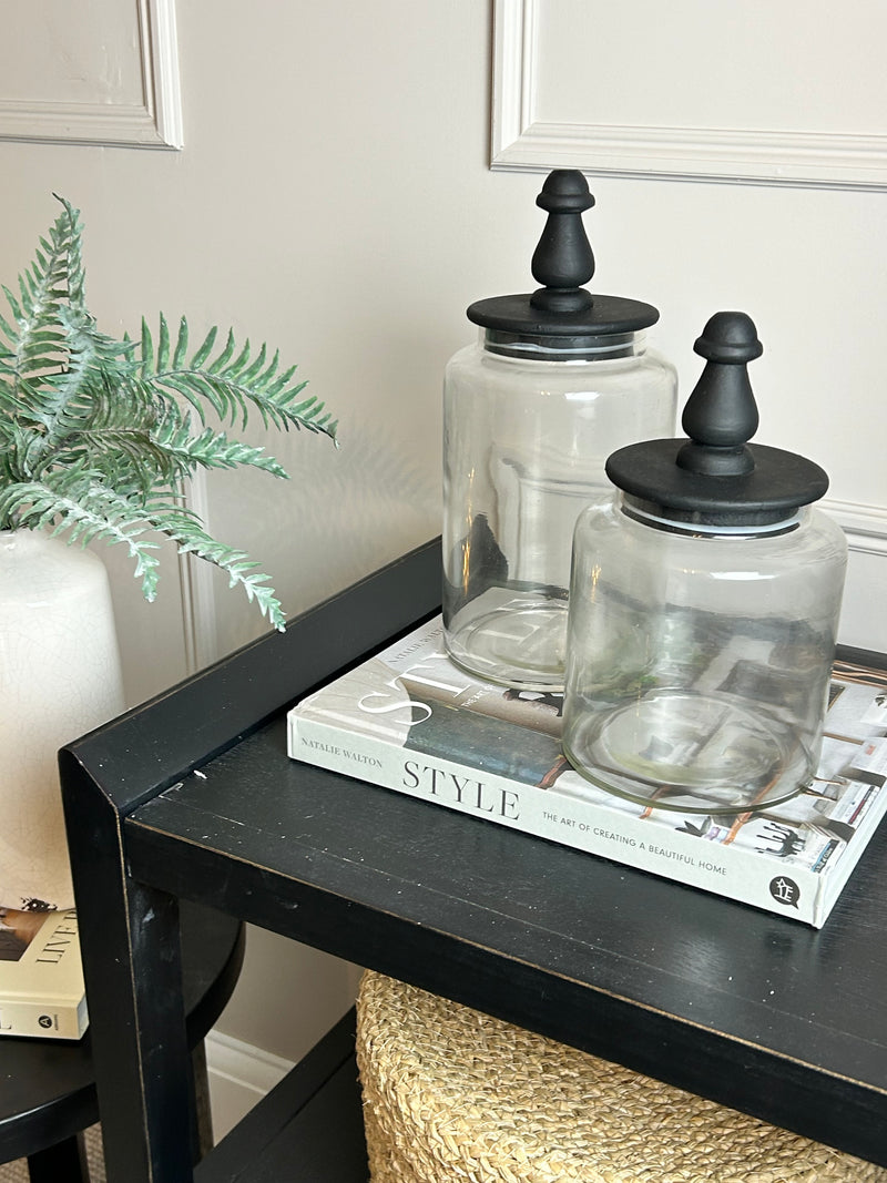 Glass jar with finial black lid