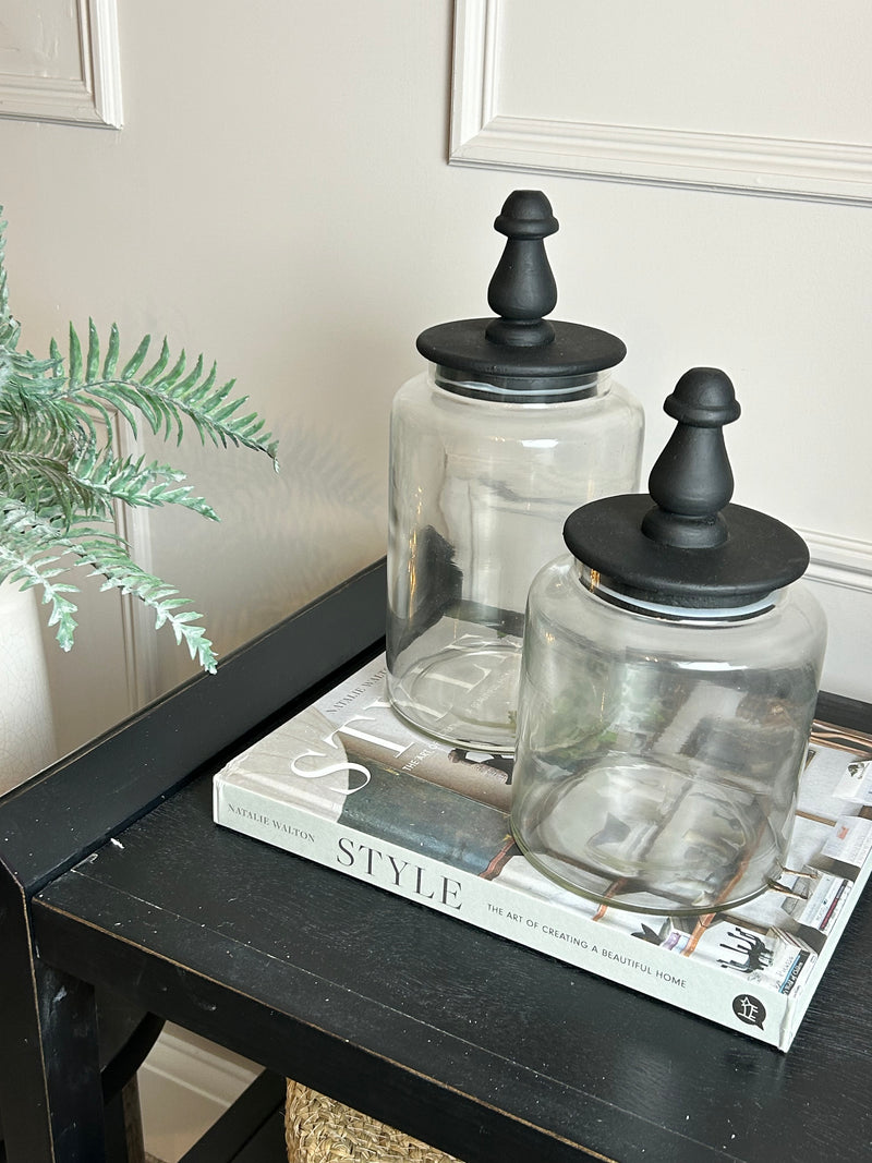 Glass jar with finial black lid