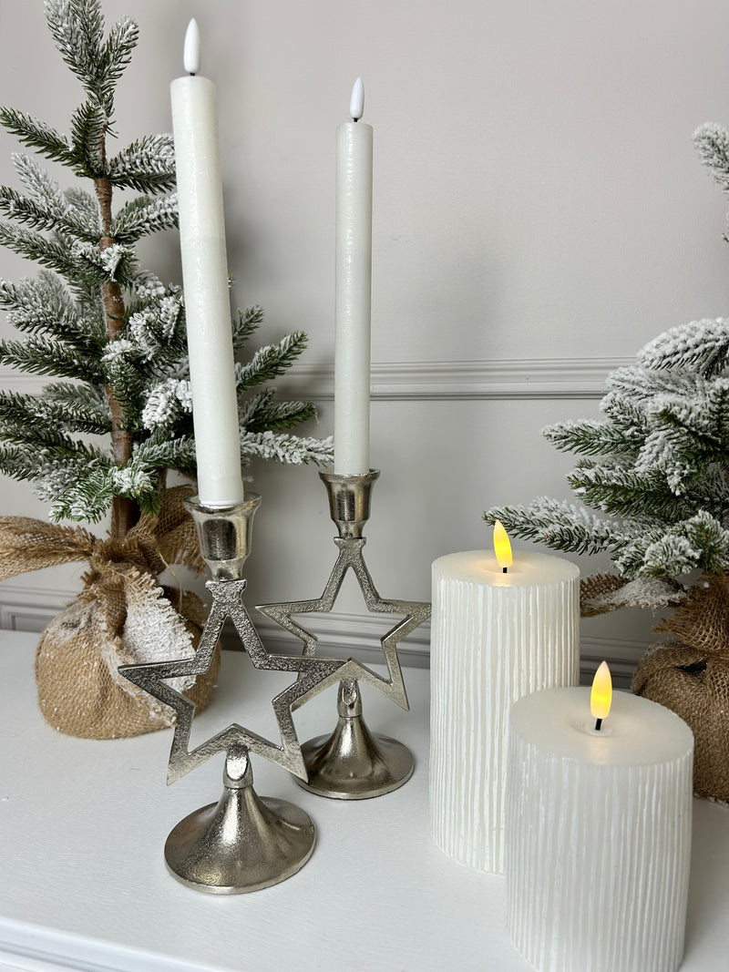 Pair of star silver candle sticks