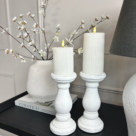 Set of two chunky white candle sticks