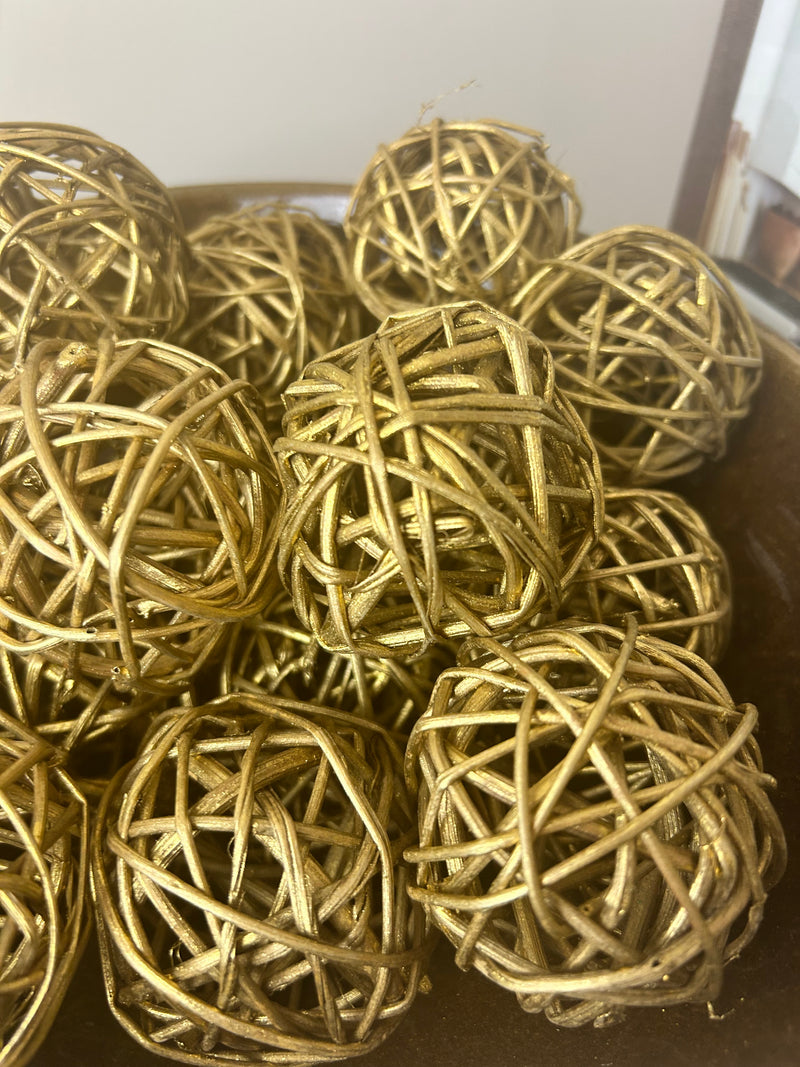 Woven gold balls in bag