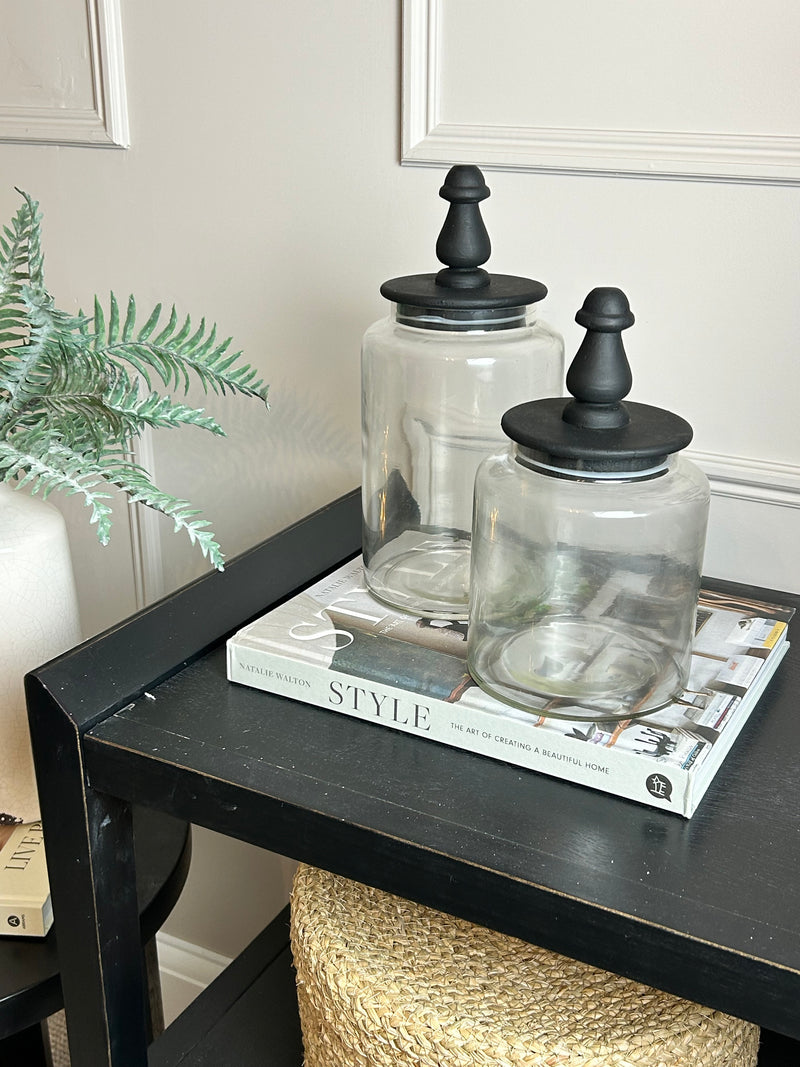 Glass jar with finial black lid