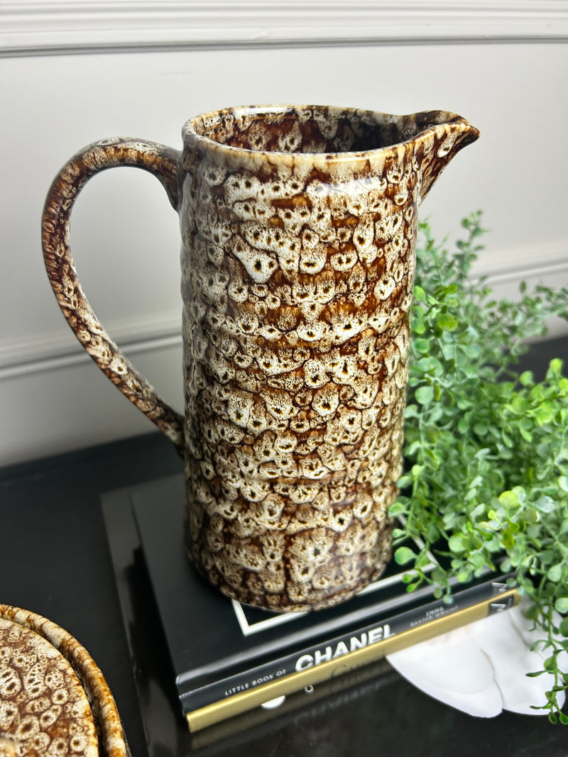 Mottled brown ceramic jug