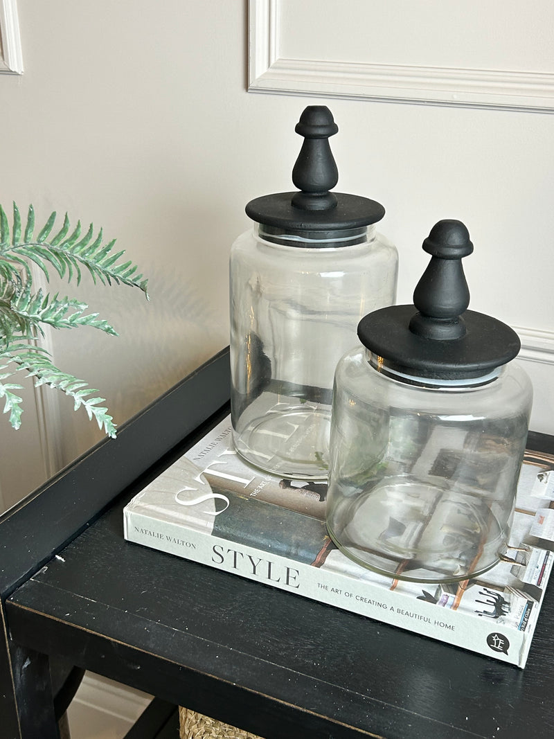 Glass jar with finial black lid