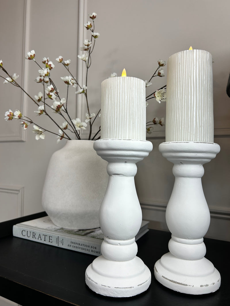 Set of two chunky white candle sticks