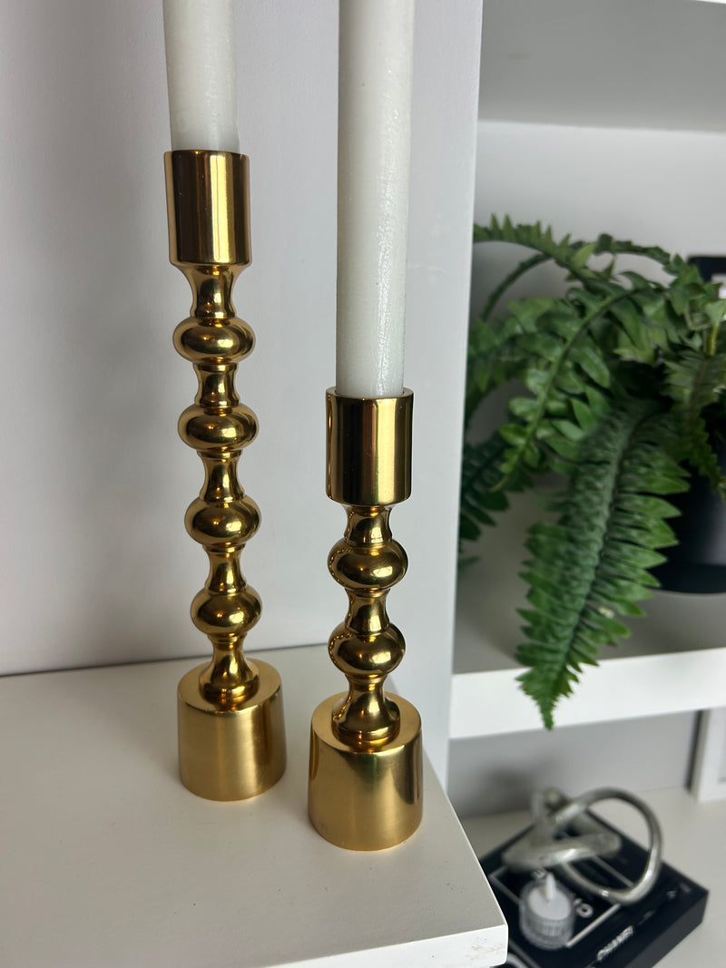 Set of two gold candle sticks ball texture