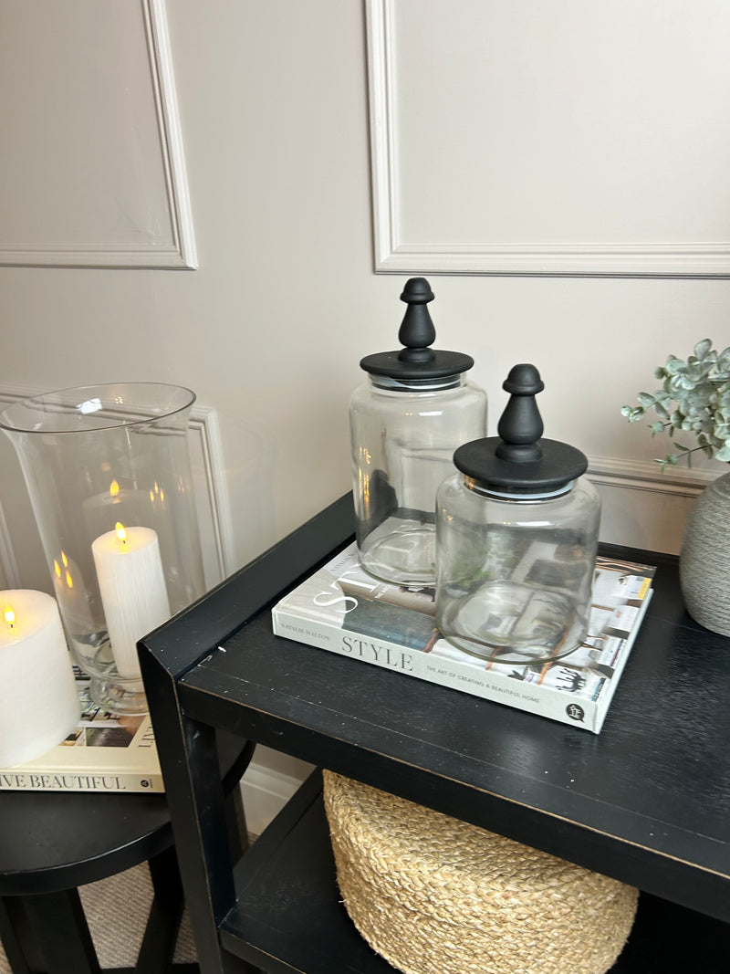 Glass jar with finial black lid