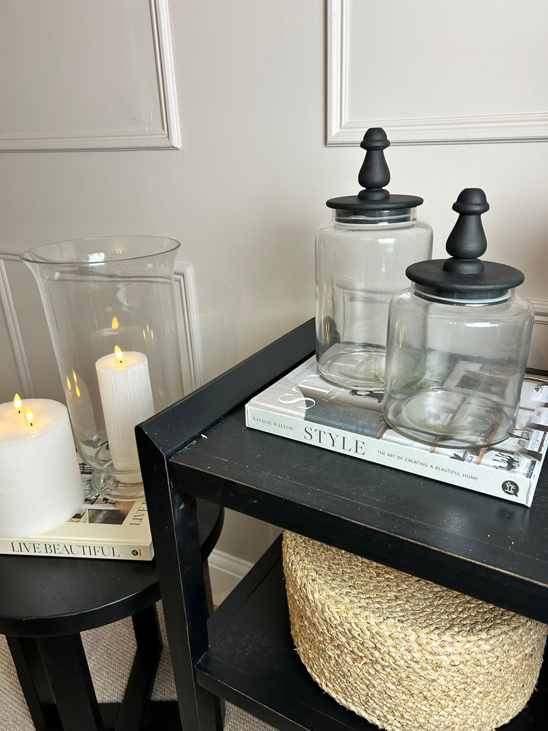 Glass jar with finial black lid