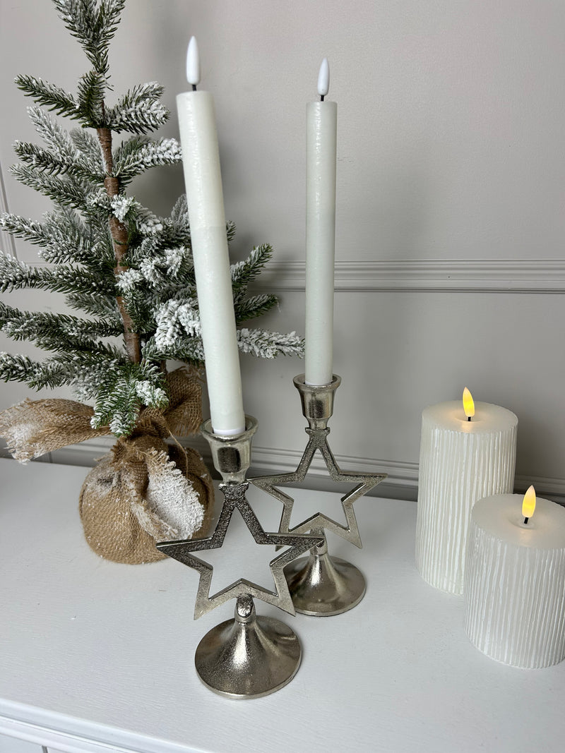 Pair of star silver candle sticks