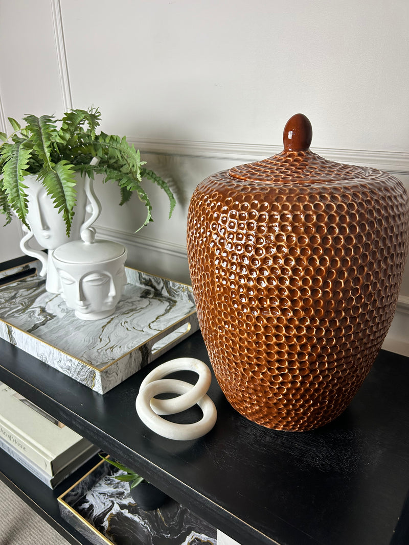 Burnt orange bobble pitted hammered ceramic lidded vase jar