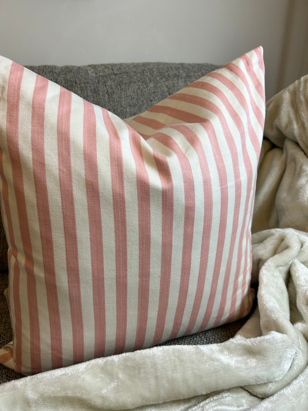 Pink and white outlet striped cushions