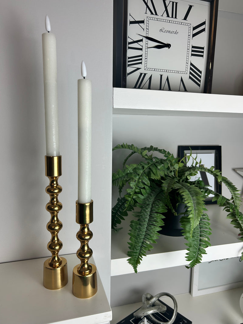 Set of two gold candle sticks ball texture