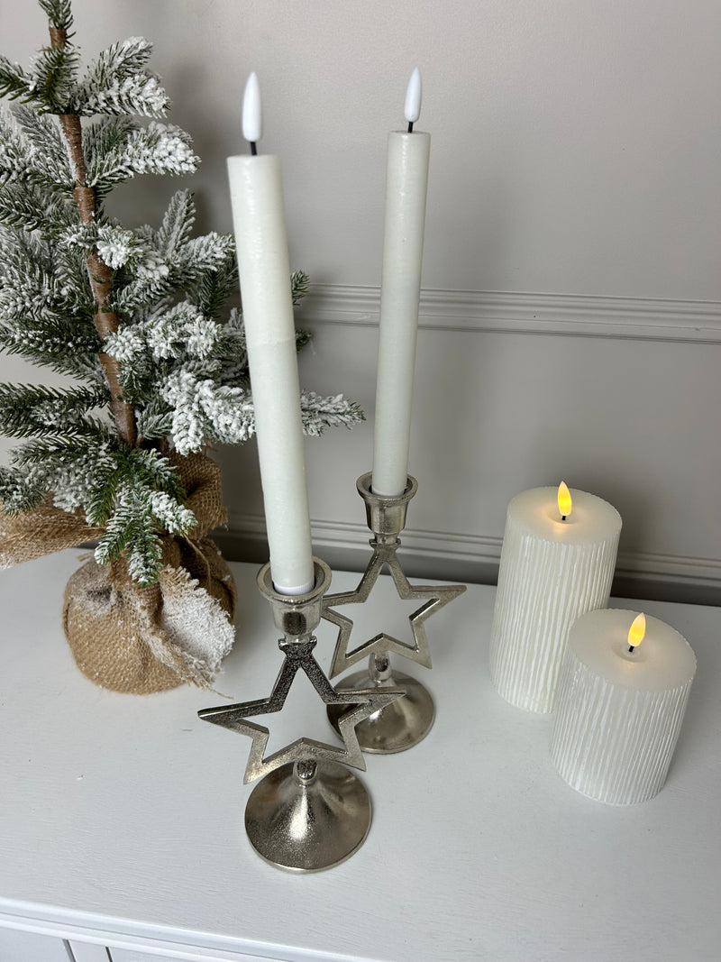 Pair of star silver candle sticks