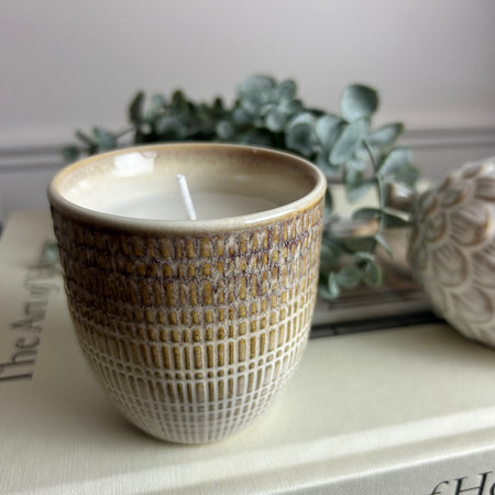 Brown filled ceramic candle