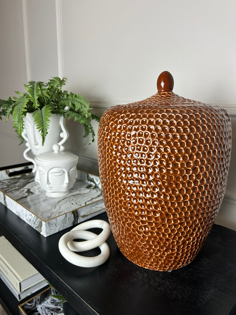 Burnt orange bobble pitted hammered ceramic lidded vase jar