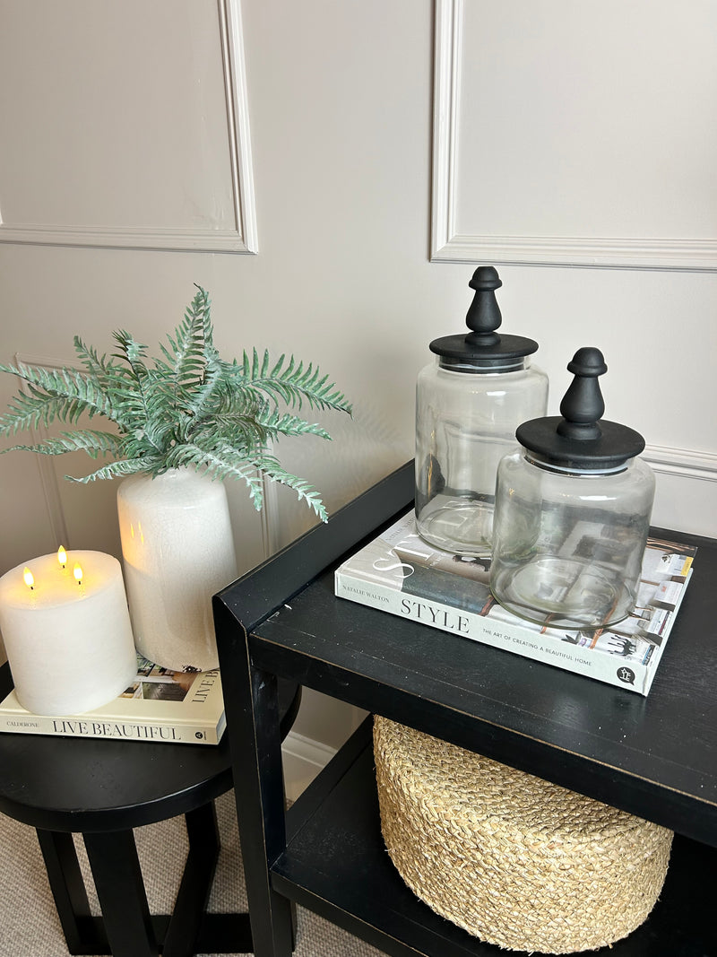 Glass jar with finial black lid