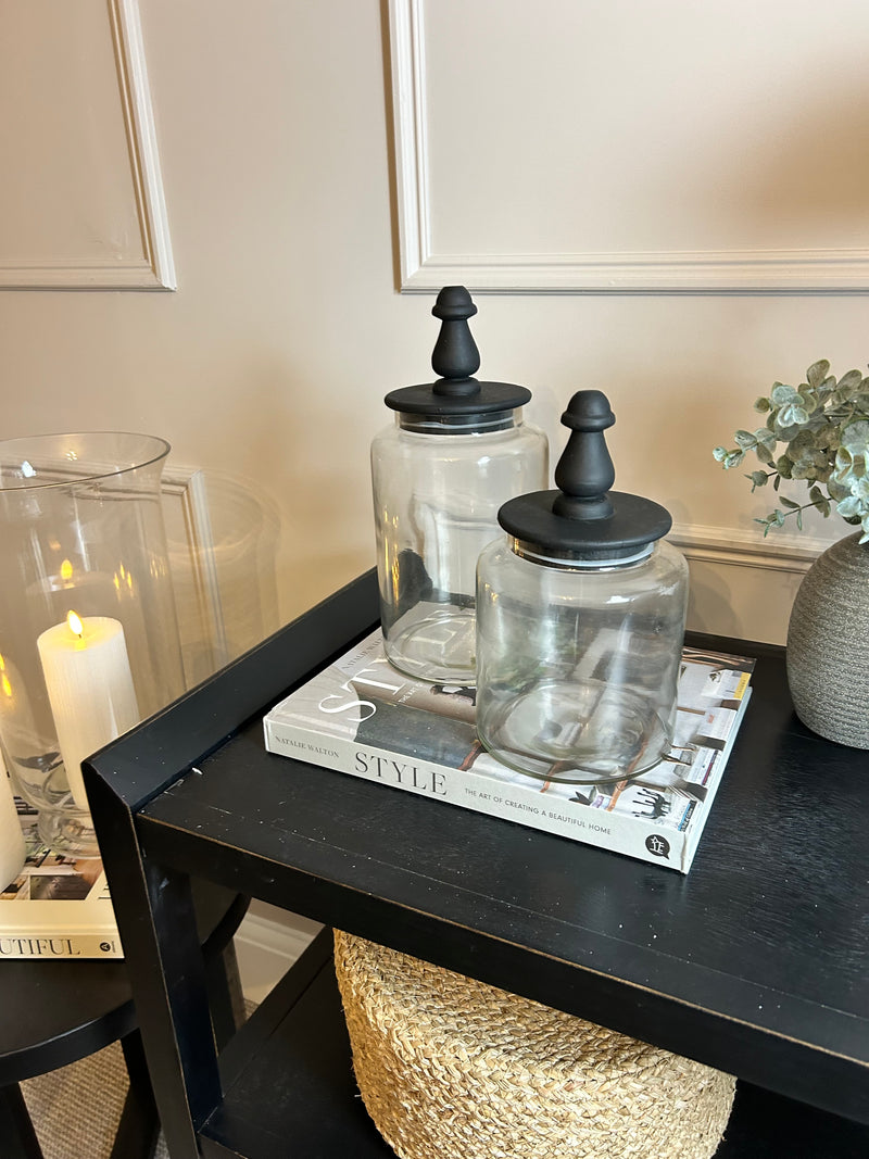 Glass jar with finial black lid