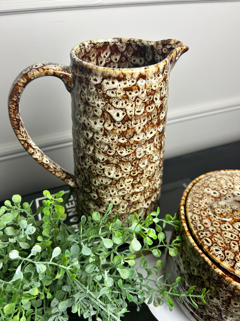 Mottled brown ceramic jug