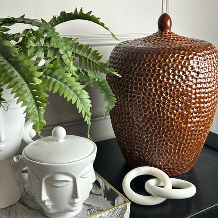 Burnt orange bobble pitted hammered ceramic lidded vase jar