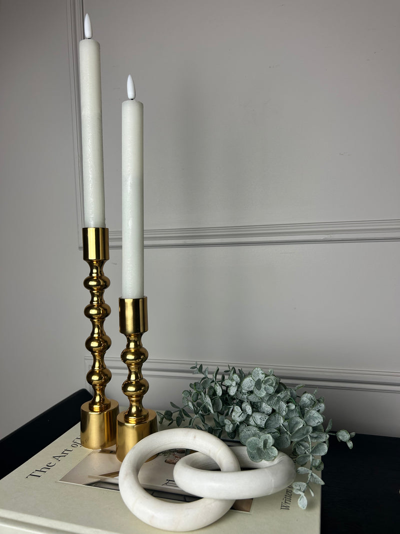 Set of two gold candle sticks ball texture