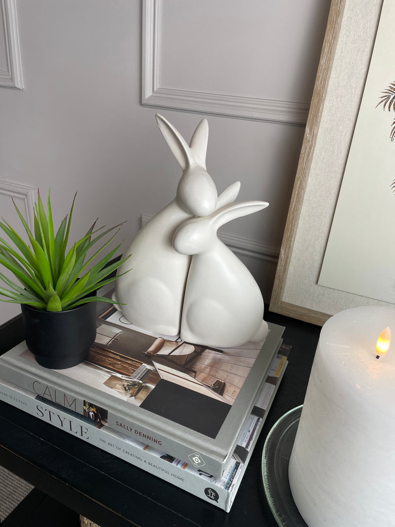 White ceramic hugging rabbits