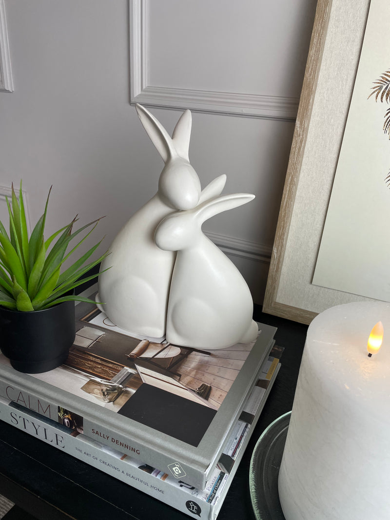 White ceramic hugging rabbits