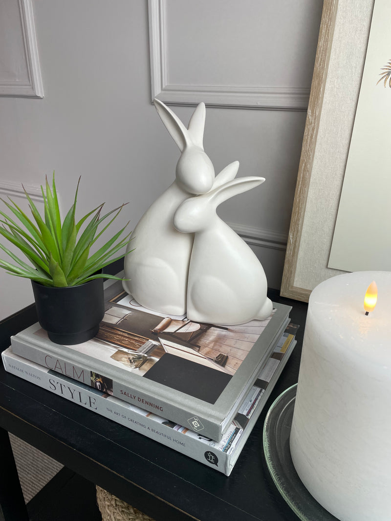 White ceramic hugging rabbits