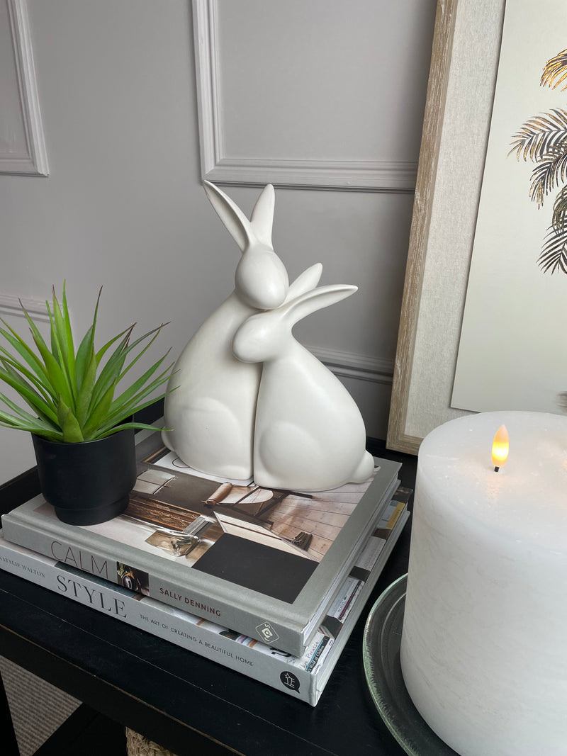 White ceramic hugging rabbits