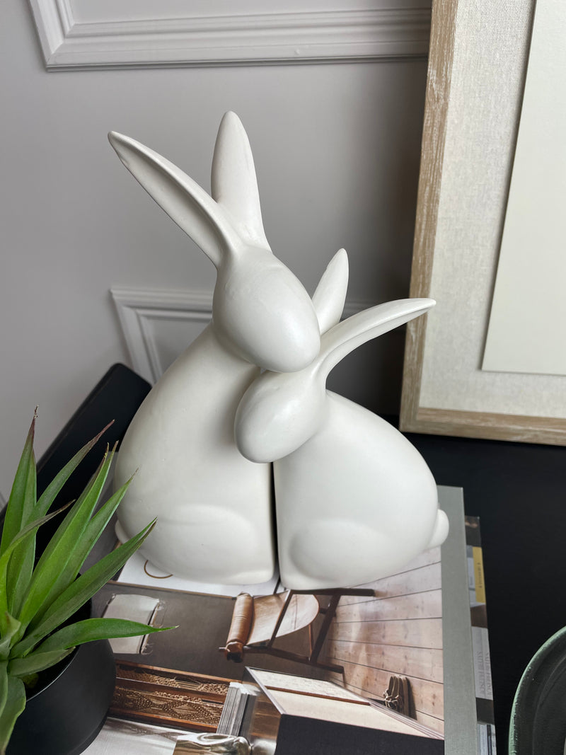 White ceramic hugging rabbits