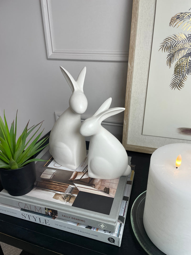 White ceramic hugging rabbits