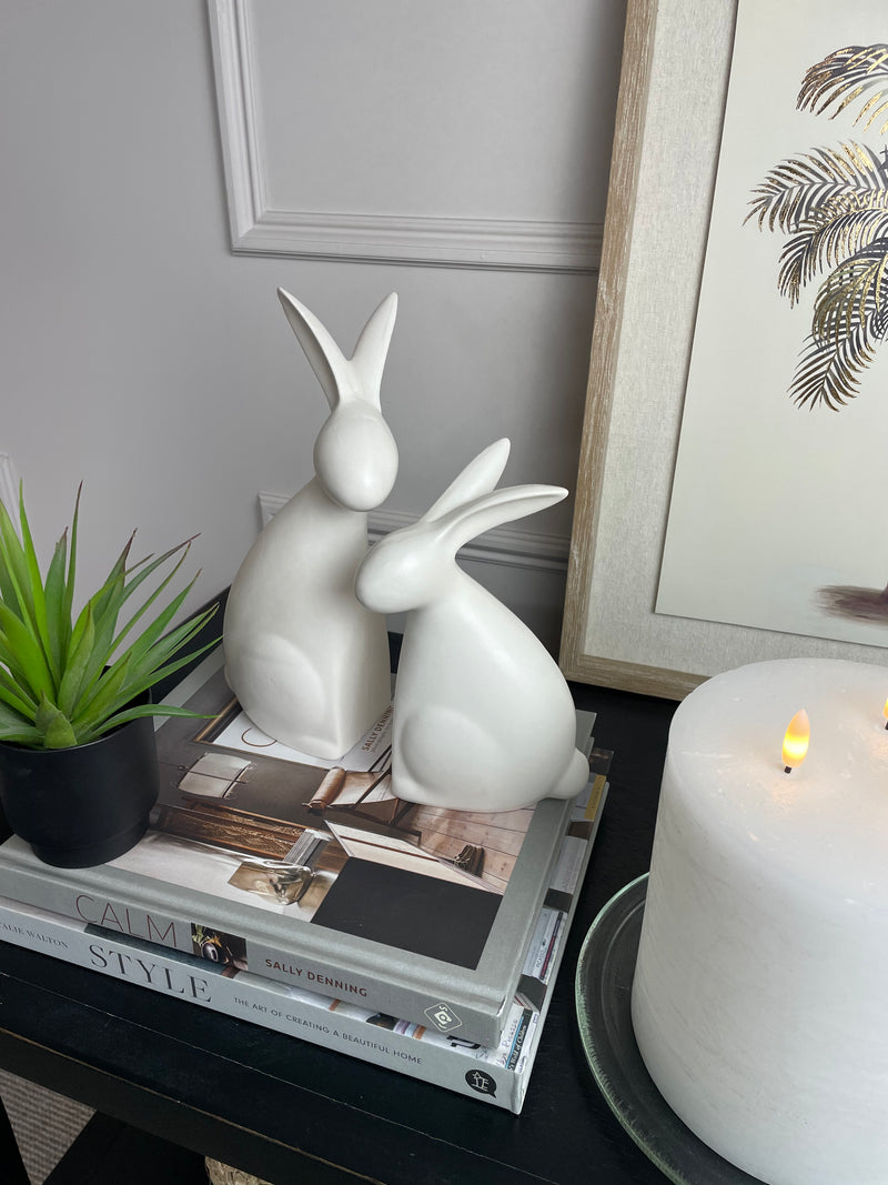 White ceramic hugging rabbits