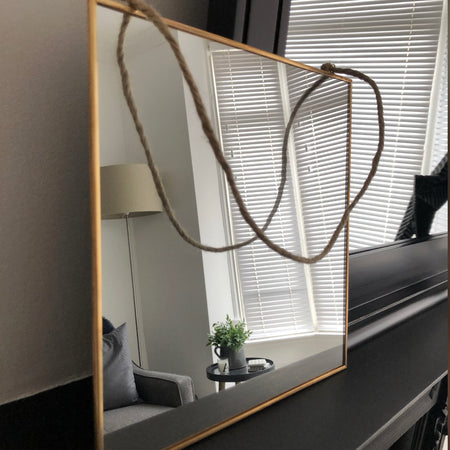 Store seconds simple gold hanging mirror