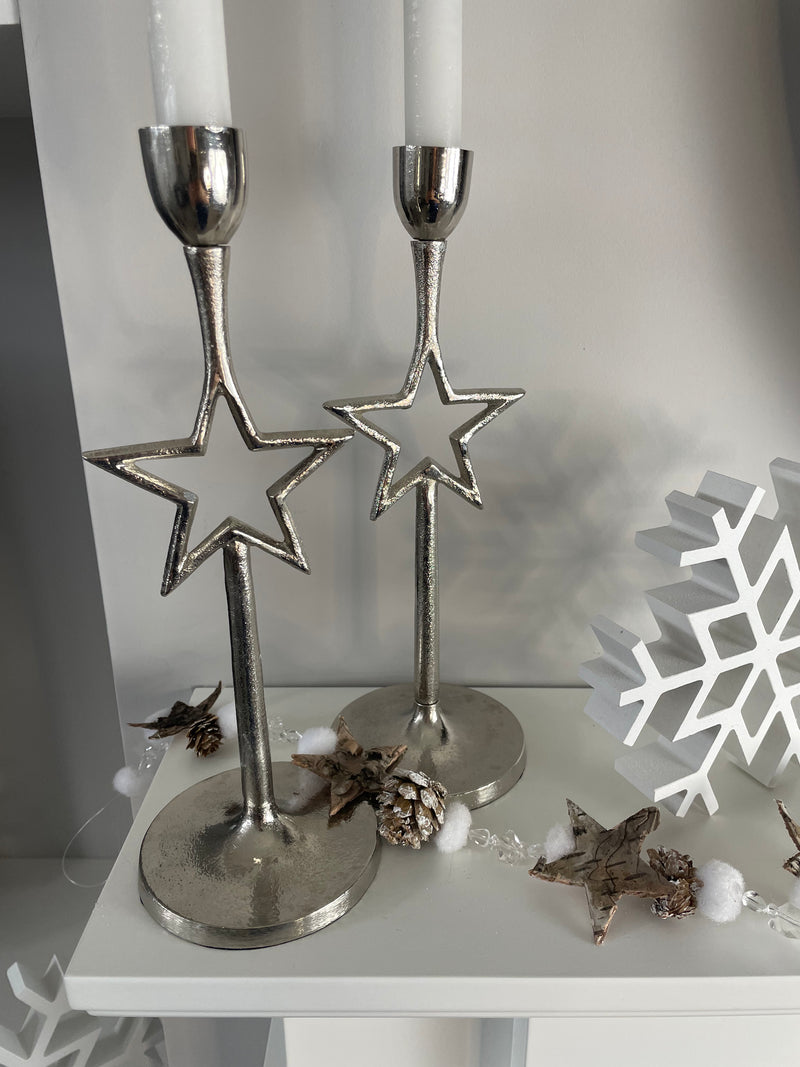 Pair of star silver candle sticks