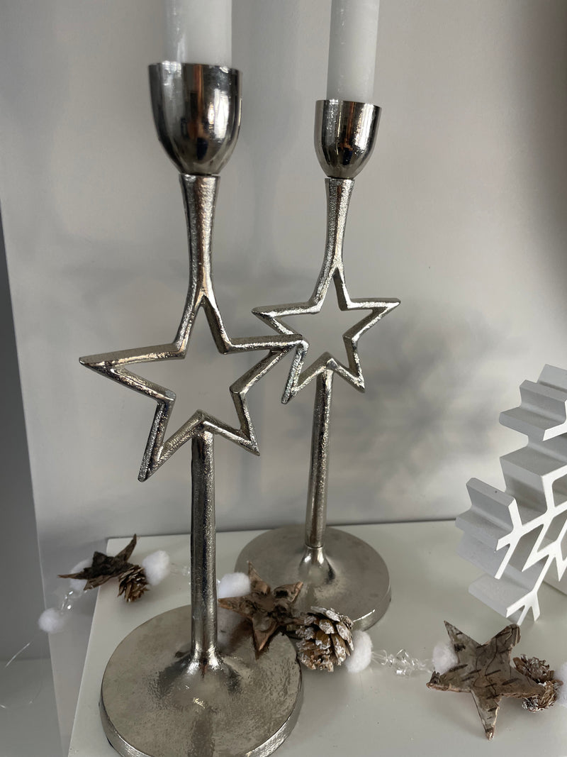 Pair of star silver candle sticks